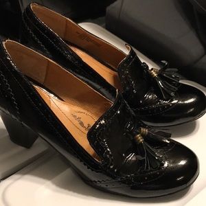 Black heels with tassels.  Soffit